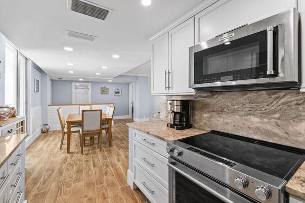 Dining room, Interior, Kitchen, Recessed Lighting, Stainless Steel Appliances, Wood Texture Flooring