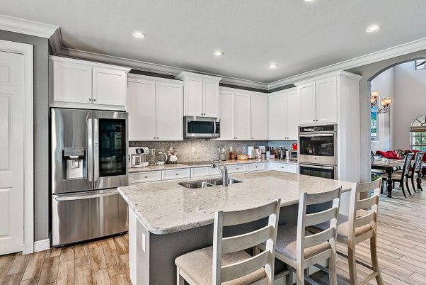 Dining room, Interior, Kitchen, Recessed Lighting, Stainless Steel Appliances, Wood Texture Flooring