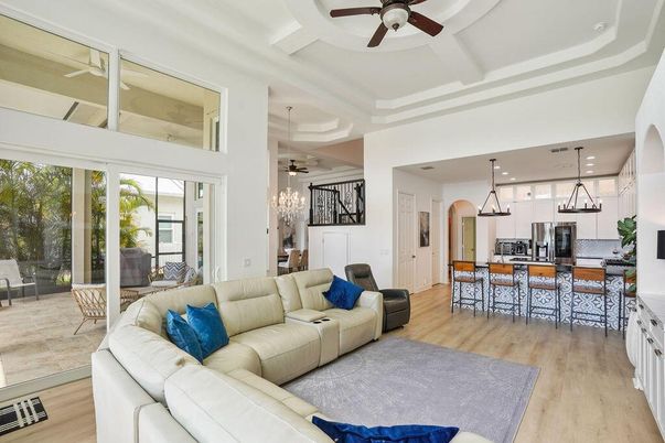 Chandelier, Dining room, Interior, Kitchen, Living room, Pendant Lights, Recessed Lighting, Stainless Steel Appliances, Wood Texture Flooring