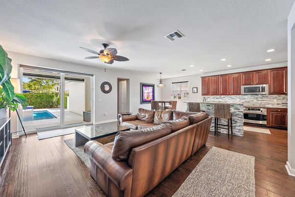 Dining room, Interior, Kitchen, Living room, Pendant Lights, Recessed Lighting, Stainless Steel Appliances, Wood Texture Flooring