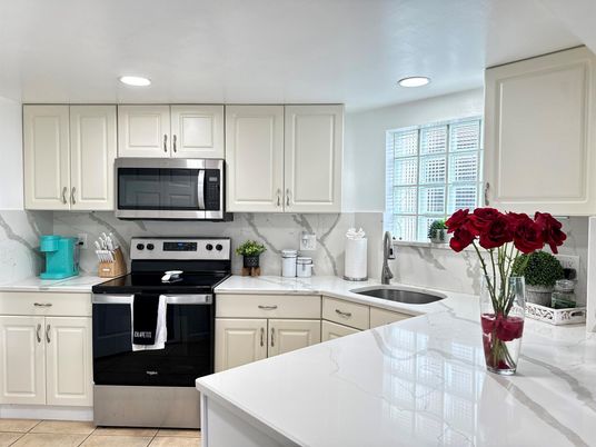 Interior, Kitchen, Marble Walls, Recessed Lighting, Stainless Steel Appliances