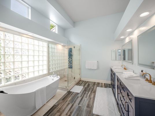 Bathroom, Dual Sink Vanities, Free Standing Baths, Glass Shower, Interior, Recessed Lighting, Wood Texture Flooring