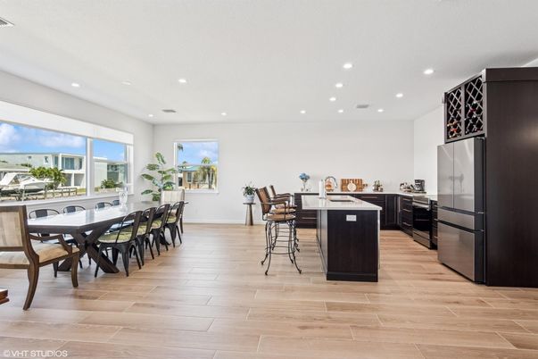 Dining room, Interior, Kitchen, Recessed Lighting, Stainless Steel Appliances, Wood Texture Flooring