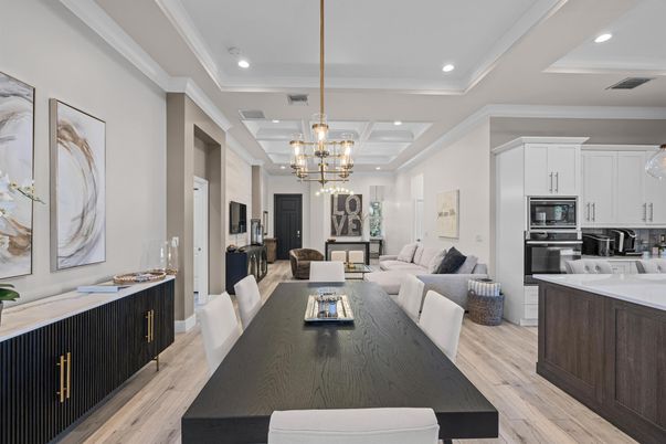Chandelier, Dining room, Interior, Kitchen, Living room, Pendant Lights, Recessed Lighting, Stainless Steel Appliances, Wood Texture Flooring