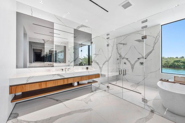 Bathroom, Dual Sink Vanities, Free Standing Baths, Glass Shower, Interior, Marble, Marble Walls, Recessed Lighting, Water