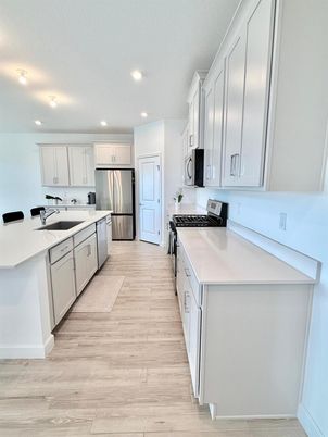Interior, Kitchen, Recessed Lighting, Stainless Steel Appliances, Wood Texture Flooring