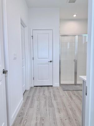 Bathroom, Glass Shower, Interior, Recessed Lighting, Wood Texture Flooring