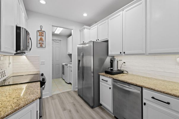Interior, Kitchen, Recessed Lighting, Washer, Wood Texture Flooring