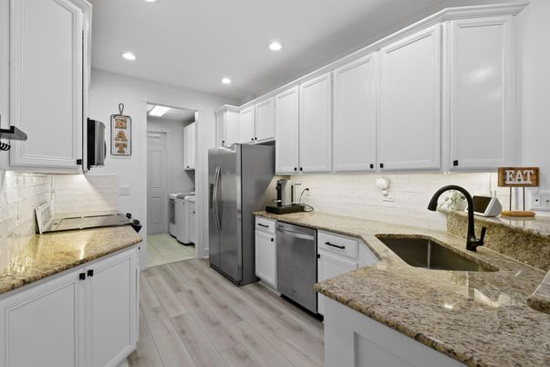 Interior, Kitchen, Recessed Lighting, Washer, Wood Texture Flooring