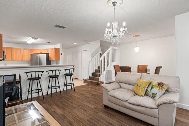 Chandelier, Dining room, Interior, Kitchen, Pendant Lights, Recessed Lighting, Stainless Steel Appliances, Wood Texture Flooring