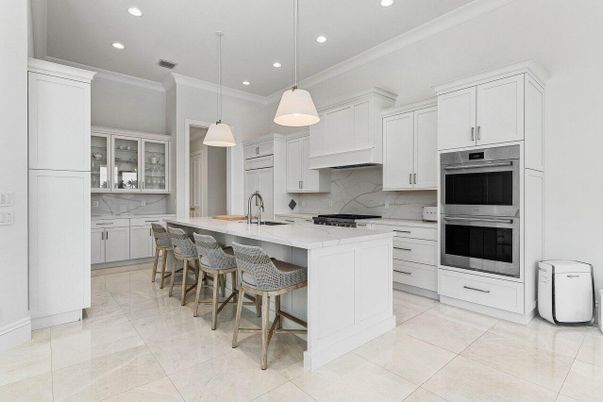 Interior, Kitchen, Marble Walls, Pendant Lights, Recessed Lighting, Stainless Steel Appliances
