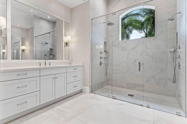 Bathroom, Dual Sink Vanities, Glass Shower, Interior, Marble, Marble Walls, Recessed Lighting