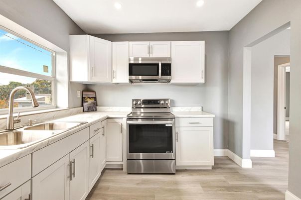 Interior, Kitchen, Recessed Lighting, Stainless Steel Appliances, Wood Texture Flooring