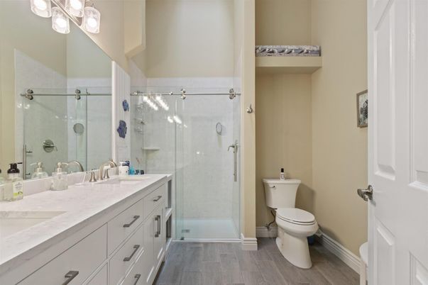 Bathroom, Dual Sink Vanities, Glass Shower, Interior, Wood Texture Flooring