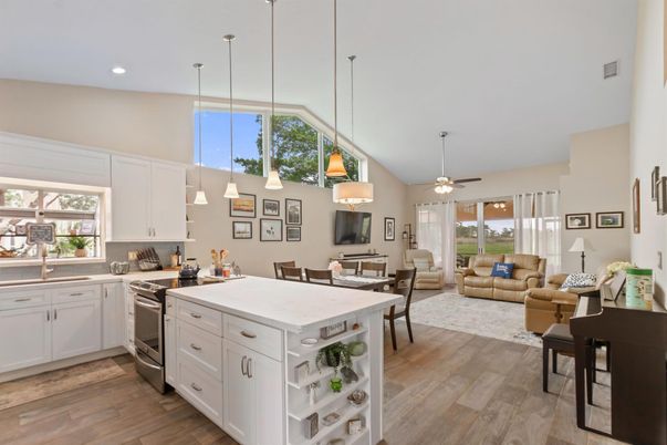 Dining room, Interior, Kitchen, Living room, Pendant Lights, Recessed Lighting, Stainless Steel Appliances, Wood Texture Flooring