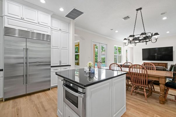 Chandelier, Dining room, Interior, Kitchen, Recessed Lighting, Stainless Steel Appliances, Wood Texture Flooring