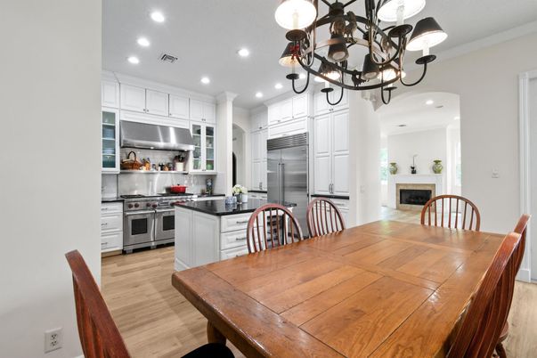 Chandelier, Dining room, Interior, Kitchen, Recessed Lighting, Stainless Steel Appliances, Wood Texture Flooring