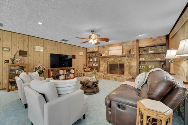 Dining room, Fireplace, Interior, Living room, Recessed Lighting, Stone Walls, Wooden Walls