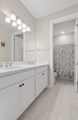 Bathroom, Dual Sink Vanities, Interior, Marble Walls, Recessed Lighting