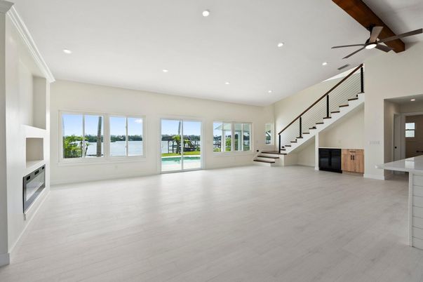 Empty room, Fireplace, Interior, Recessed Lighting, Water, Wood Texture Flooring