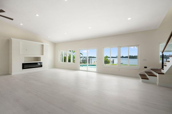 Empty room, Fireplace, Interior, Recessed Lighting, Water, Wood Texture Flooring