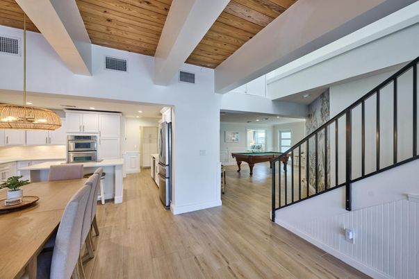 Billiard Table, Chandelier, Dining room, Interior, Kitchen, Pendant Lights, Recessed Lighting, Stainless Steel Appliances, Wooden Ceilings, Wood Texture Flooring