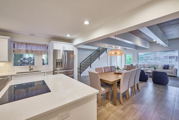 Chandelier, Dining room, Interior, Kitchen, Living room, Recessed Lighting, Stainless Steel Appliances, Wood Texture Flooring