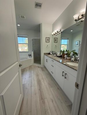 Bathroom, Dual Sink Vanities, Glass Shower, Interior, Recessed Lighting, Wood Texture Flooring