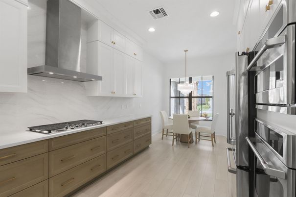 Dining room, Interior, Kitchen, Marble Walls, Pendant Lights, Recessed Lighting, Stainless Steel Appliances, Wood Texture Flooring