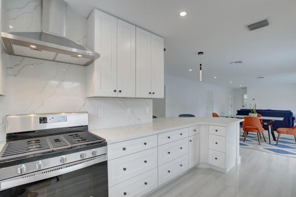Dining room, Interior, Kitchen, Marble Walls, Pendant Lights, Recessed Lighting, Stainless Steel Appliances, Wood Texture Flooring