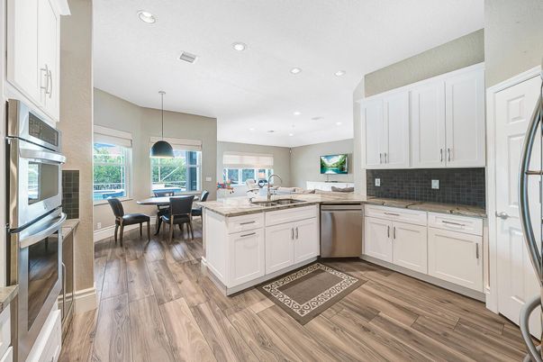 Dining room, Interior, Kitchen, Pendant Lights, Recessed Lighting, Stainless Steel Appliances, Wood Texture Flooring