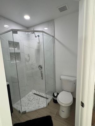 Bathroom, Glass Shower, Interior, Marble Walls, Recessed Lighting, Wood Texture Flooring
