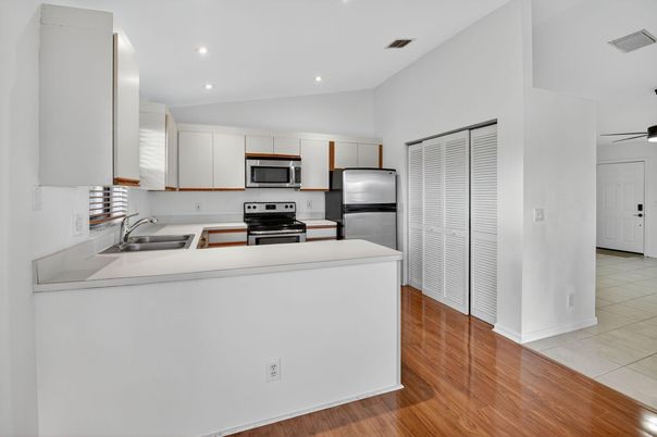 Interior, Kitchen, Recessed Lighting, Stainless Steel Appliances, Wood Texture Flooring