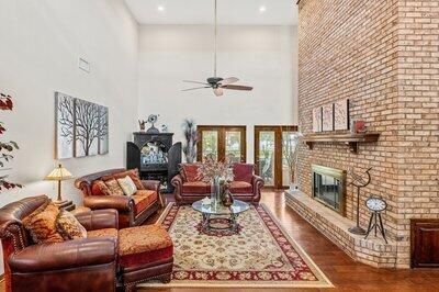 Fireplace, Interior, Living room, Recessed Lighting, Stone Walls, Wood Texture Flooring