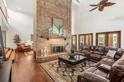 Fireplace, Interior, Living room, Recessed Lighting, Stone Walls, Wood Texture Flooring