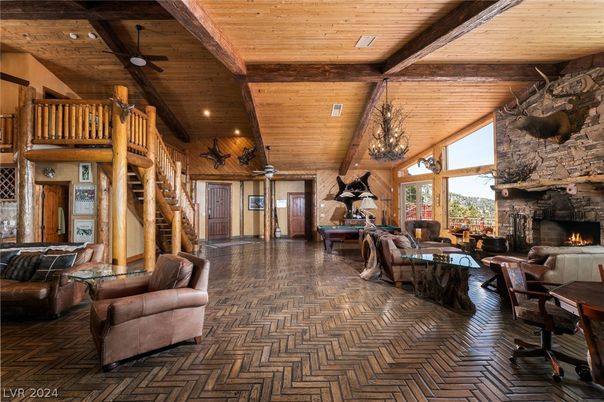 Chandelier, Fireplace, Interior, Living room, Recessed Lighting, Stone Walls, Wooden Beams, Wooden Ceilings, Wood Texture Flooring