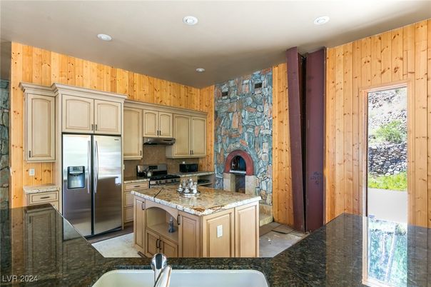 Fireplace, Interior, Kitchen, Recessed Lighting, Stainless Steel Appliances, Stone Walls
