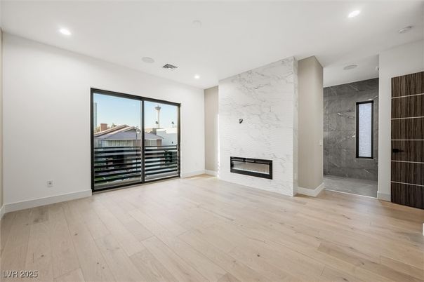 Empty room, Fireplace, Interior, Marble Walls, Recessed Lighting, Wood Texture Flooring