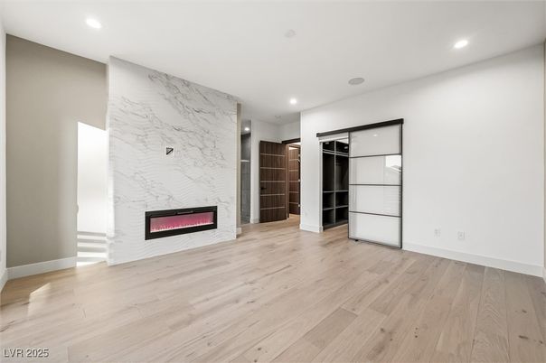 Empty room, Fireplace, Interior, Marble Walls, Recessed Lighting, Wood Texture Flooring