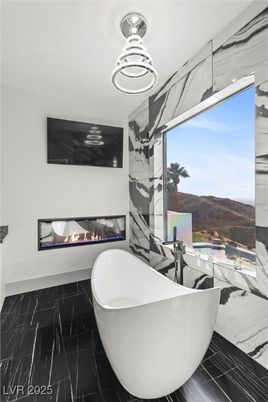 Bathroom, Fireplace, Free Standing Baths, Interior, Marble, Marble Walls, Pendant Lights