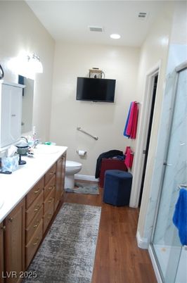 Bathroom, Dual Sink Vanities, Glass Shower, Interior, Recessed Lighting, Wood Texture Flooring