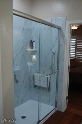 Bathroom, Glass Shower, Interior, Marble Walls, Wood Texture Flooring