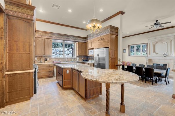 Chandelier, Dining room, Fireplace, Interior, Kitchen, Recessed Lighting, Stainless Steel Appliances