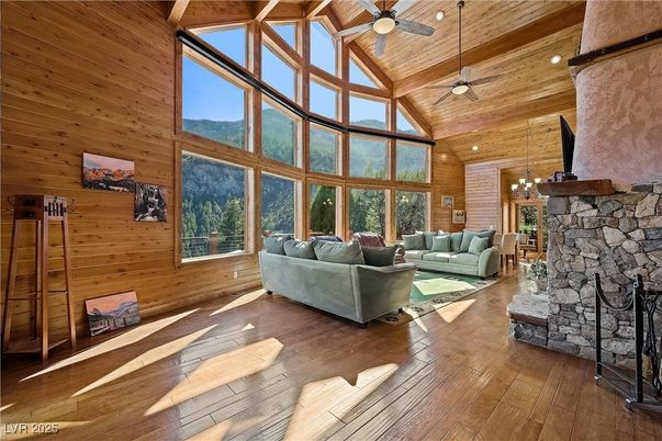 Chandelier, Fireplace, Interior, Living room, Recessed Lighting, Stone Walls, Wooden Ceilings, Wood Texture Flooring, Wooden Walls