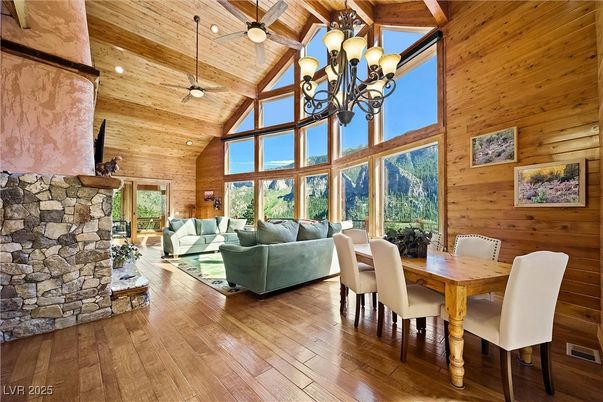 Chandelier, Dining room, Fireplace, Interior, Living room, Stone Walls, Wooden Beams, Wooden Ceilings, Wood Texture Flooring, Wooden Walls