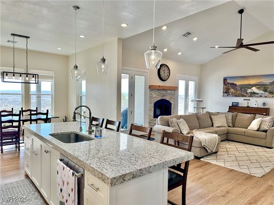 Dining room, Fireplace, Interior, Kitchen, Living room, Pendant Lights, Recessed Lighting, Water, Wood Texture Flooring
