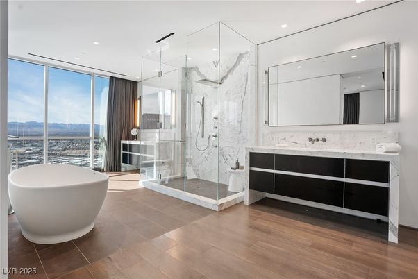 Bathroom, Free Standing Baths, Glass Shower, Interior, Marble Walls, Recessed Lighting, Wood Texture Flooring