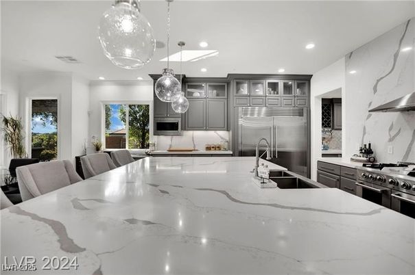 Interior, Kitchen, Marble Walls, Pendant Lights, Recessed Lighting, Stainless Steel Appliances