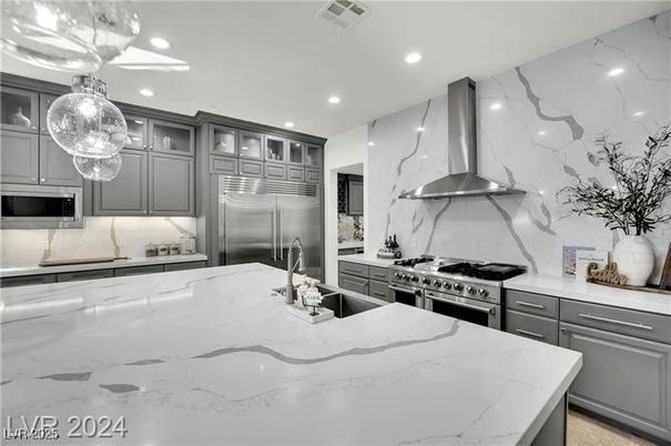 Interior, Kitchen, Marble Walls, Pendant Lights, Recessed Lighting, Stainless Steel Appliances