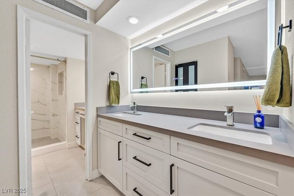 Bathroom, Dual Sink Vanities, Glass Shower, Interior, Marble Walls, Recessed Lighting